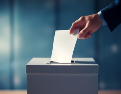 hand-inserting-ballot-paper-into-election-ballot-box-election-day-artificial-inteliigence-generated_886951-2387 (1) hand-inserting-ballot-paper-into-election-ballot-box-election-day-artificial-inteliigence-generated_886951-2387 (1)