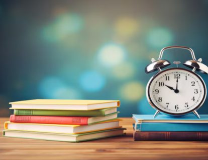 alarm-clock-stack-books-wooden-table-back-school-concept-ai-generated_497837-8145