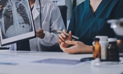 two-doctors-are-looking-at-a-medical-image-free-photo two-doctors-are-looking-at-a-medical-image-free-photo