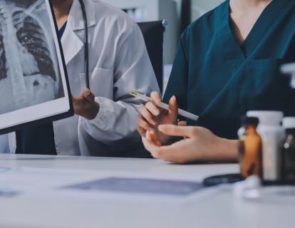 two-doctors-are-looking-at-a-medical-image-free-photo two-doctors-are-looking-at-a-medical-image-free-photo
